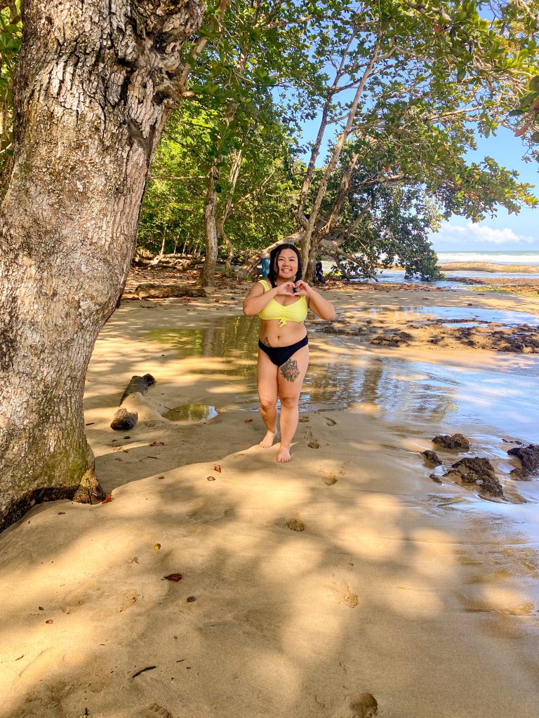 Blogger Gabrielle Sales walking the beach of Playa Bonita, Limon, Costa Rica